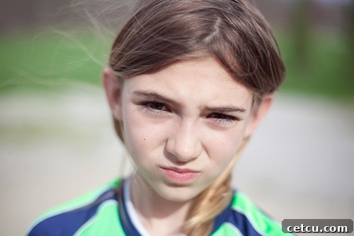 Close-up of subject squinting in bright sunlight, eyes watering