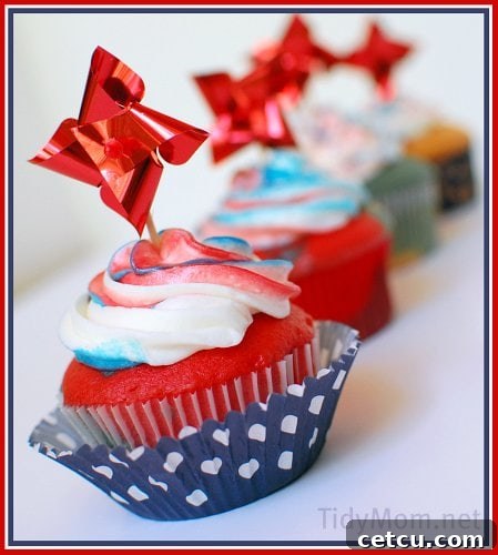 Delicious Red White and Blue Cupcakes adorned with berries