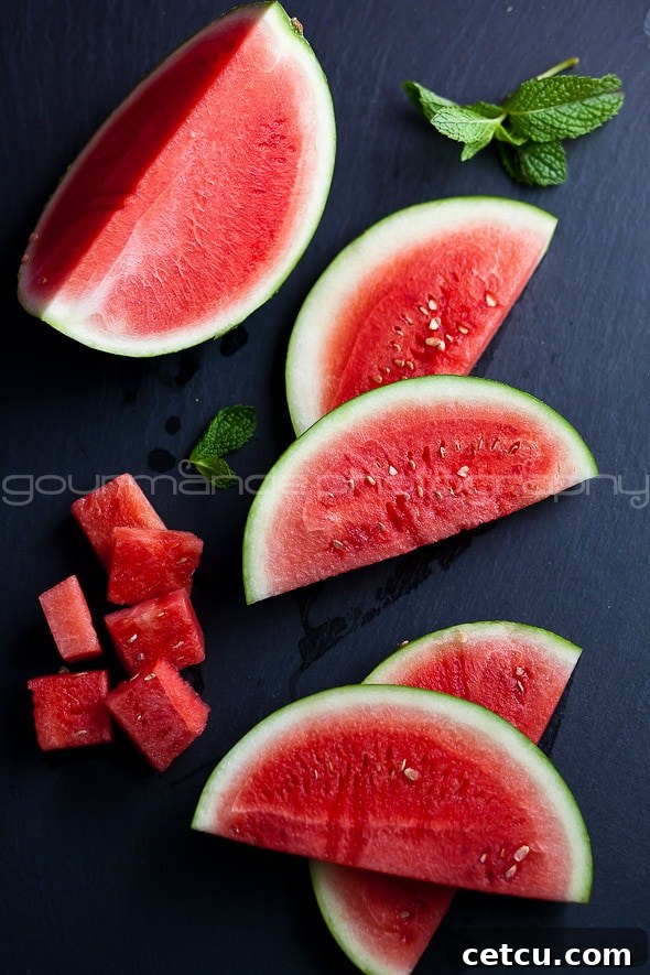 Perfectly sliced watermelon wedges and cubes, beautifully arranged for summer recipes and snacks.