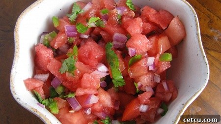 Fresh watermelon salsa with vibrant cilantro and zesty lime, served in a stylish bowl.