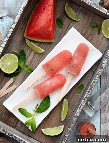 Watermelon Mojito Popsicles, vibrant and refreshing frozen treats, perfect for adults.