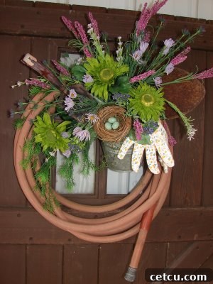 DIY Garden Hose Wreath made from repurposed tools and natural elements, showcasing sustainable garden decor.