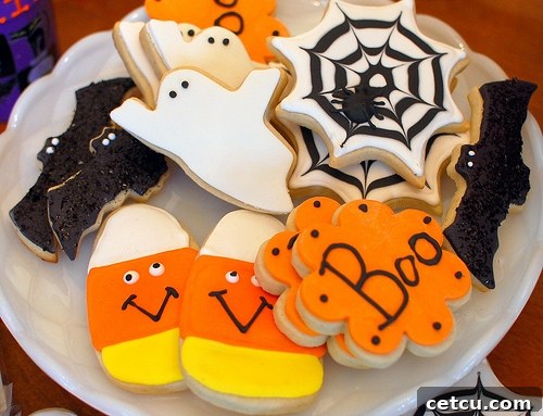 Festive Halloween cookies decorated with intricate spider webs.