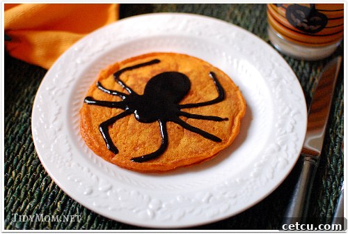 Delicious and spooky spider pumpkin pancakes, perfect for a Halloween breakfast.