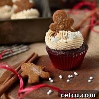 A beautifully frosted gingerbread cupcake, ready to be enjoyed.