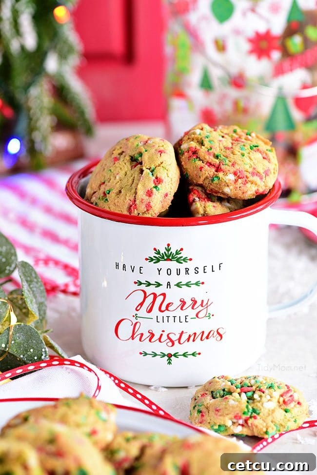 Soft-Baked Christmas Sprinkle Cookies in a festive Christmas mug, ready to be enjoyed during the holiday season.