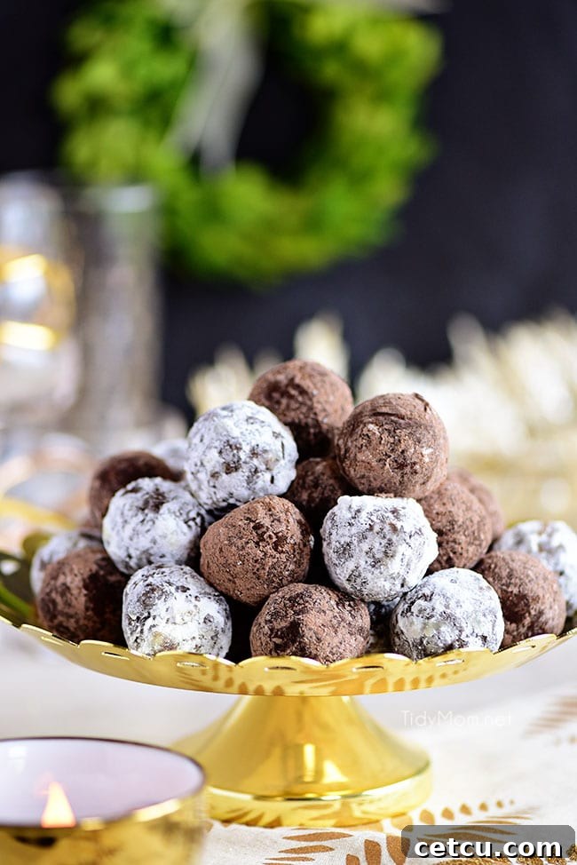 Easy Rum Balls elegantly displayed on a golden tray, a delightful no-bake treat for the holidays.