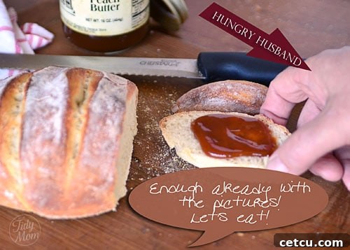 A beautiful, freshly baked artisan bread loaf, warm and inviting, ready to be sliced and enjoyed.