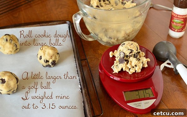 Close-up of the rich, thick chocolate chip cookie dough, studded with generous chunks of bittersweet chocolate, ready for its crucial chilling period.