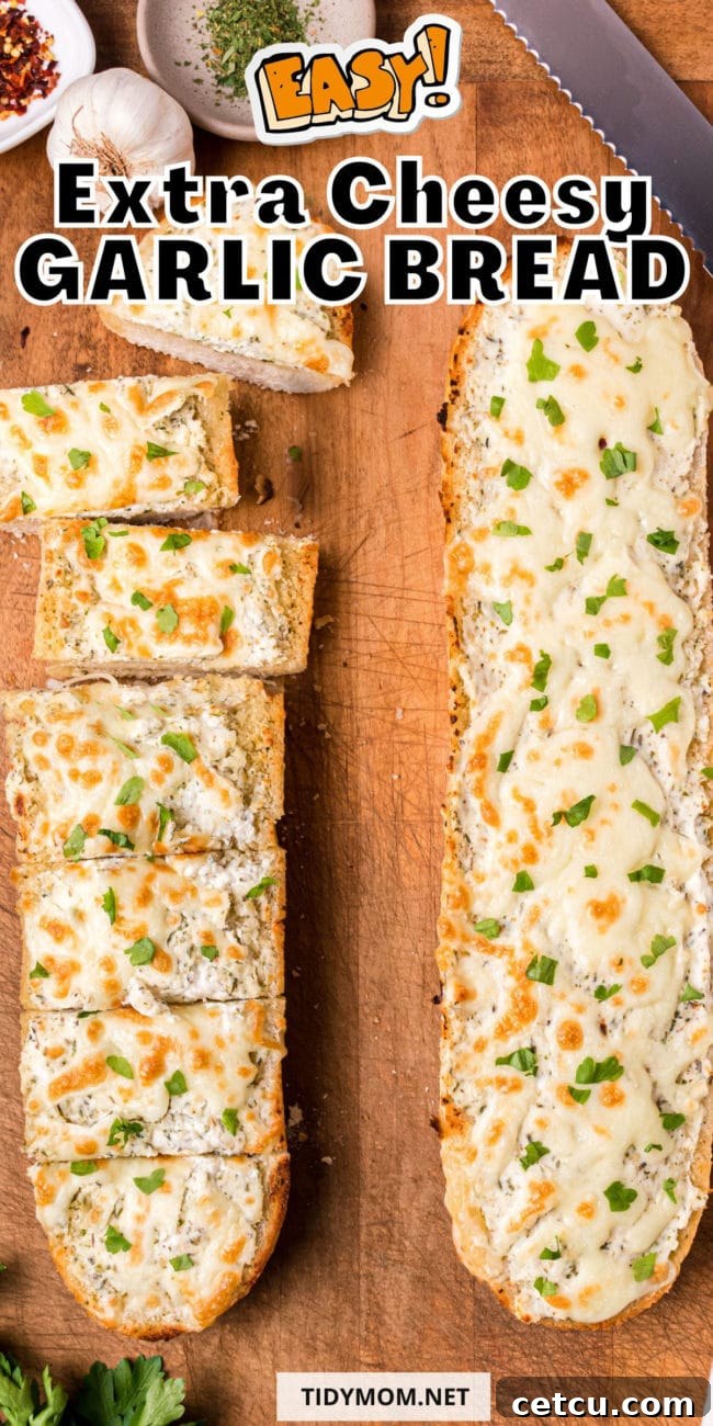 Close-up of baked loaves of cheesy garlic bread, golden and bubbly, with visible herbs and melted cheese.