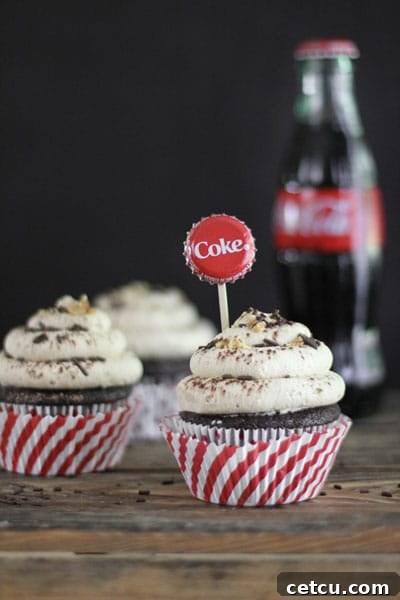 Delicious Coca-Cola Cupcakes with Salted Peanut Butter Frosting from SprinkleBakes