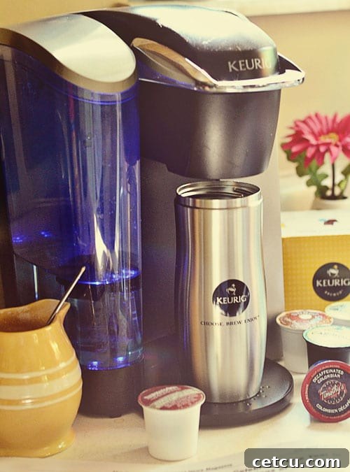 Smiling Keurig K-Cup Ambassador with a branded coffee mug