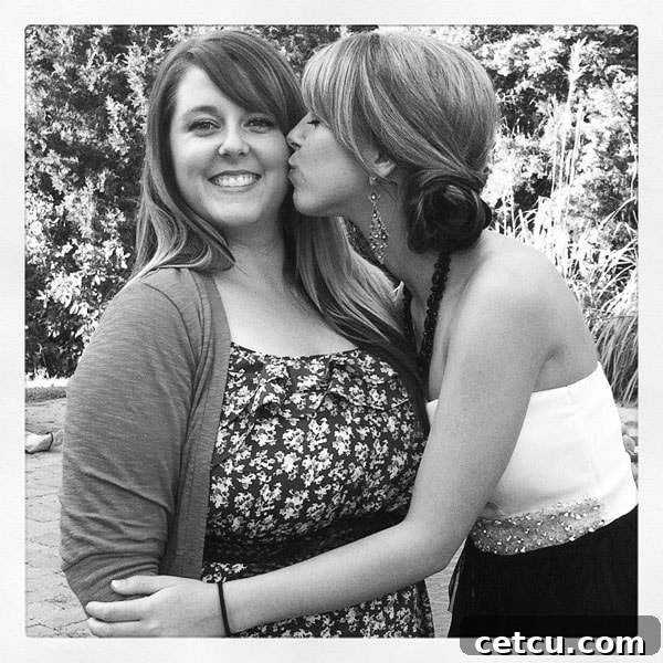 Sisters sharing a special moment before Homecoming, showcasing a beautiful updo