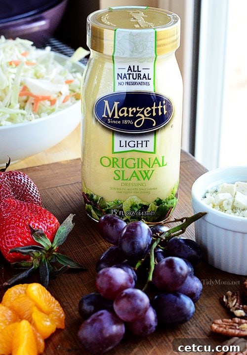 Jar of Marzetti's Slaw Dressing, a key ingredient for a quick and easy Fruit and Nut Slaw.