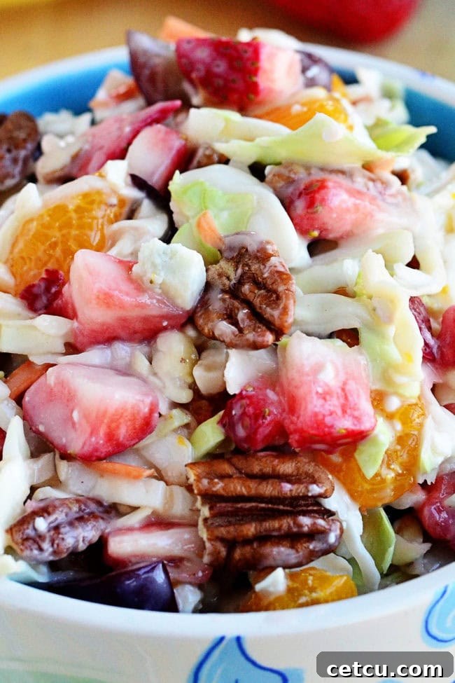 Detailed close-up of Fruit and Nut Slaw with visible blue cheese crumbles.