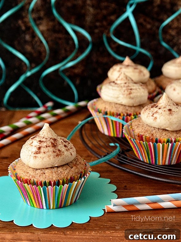 Close-up of Snickerdoodle Cupcakes with frosting and cinnamon dusting.
