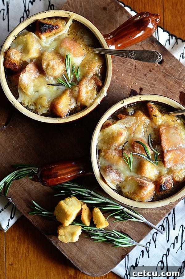 A close-up shot of a steaming bowl of French Onion Soup, ready to be enjoyed.