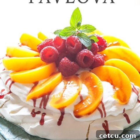 Peach Melba Pavlova on a tray, ready to be served.
