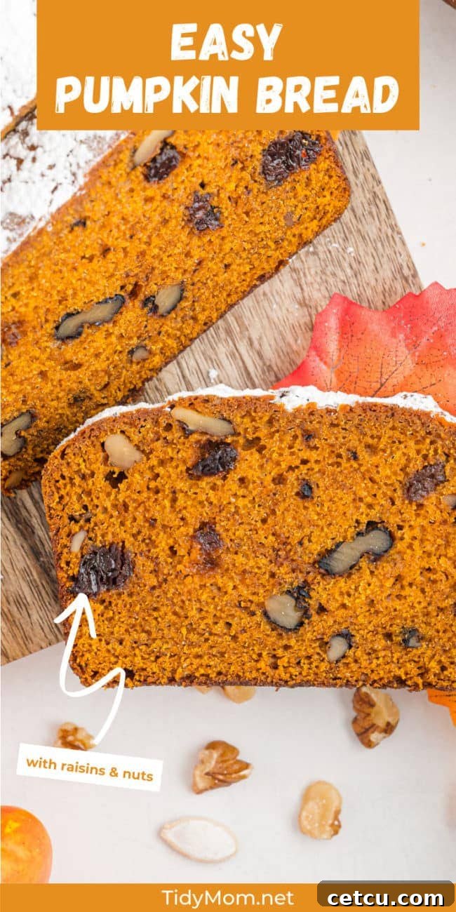 A beautifully presented pumpkin bread, expertly sliced and arranged on a rustic serving board, ready to be enjoyed.
