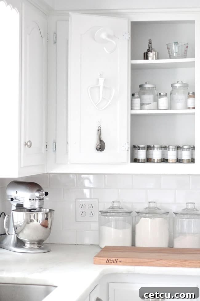 Mastering the White Home: Smart Storage for Pristine Living 5 Organized White Kitchen with Maximized Cabinet Space and Storage Solutions