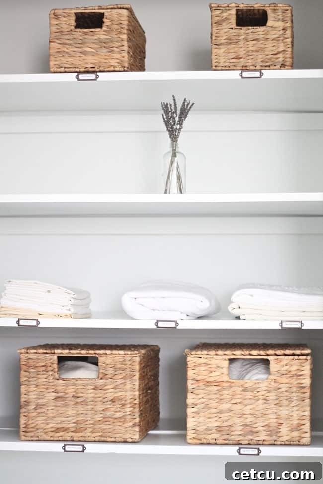 Mastering the White Home: Smart Storage for Pristine Living 8 Organized White Linen Closet with Baskets and Folded Linens