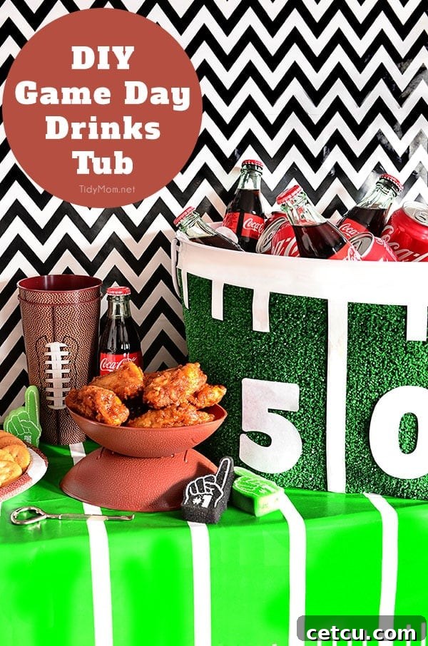 A close-up of a DIY Football Drink Tub, featuring artificial turf, a white 50-yard line, and bottles of Coca-Cola on ice.
