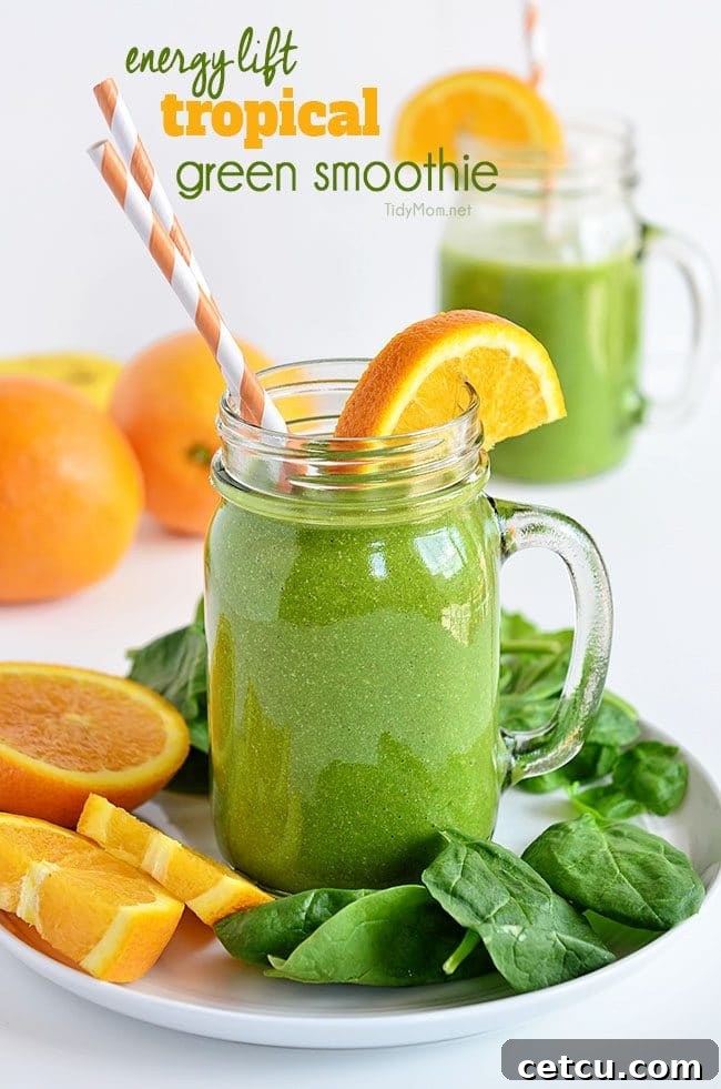 Energy Lift Tropical Green Smoothie with straws on a plate, a perfect healthy boost for college students