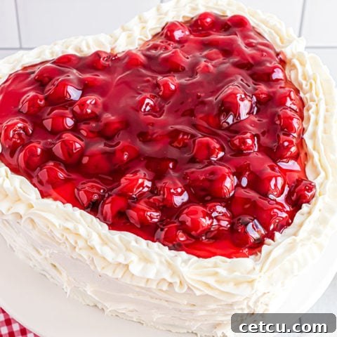 heart shaped cheery cake with butter cream frosting