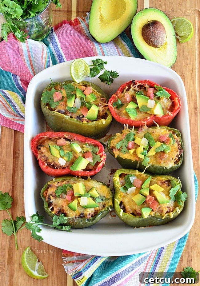Fresh Bell peppers are filled with rice, browned ground beef seasoned with McCormick Organic Taco Seasoning, black beans, tomatoes, green chilies and cheese for an easy weeknight dinner with a southwest twist. Southwest Stuffed Peppers recipe at TidyMom.net