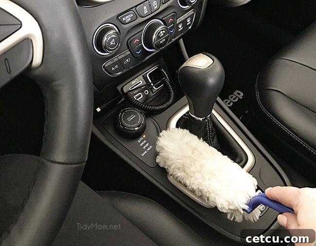 Quick dusting of car dashboard with a duster.