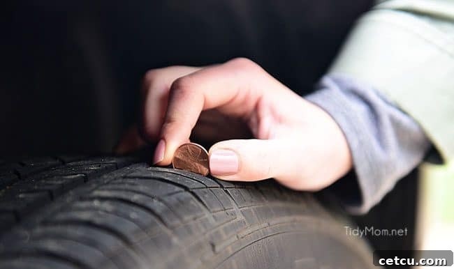 Using a penny to check tire tread depth for safety.