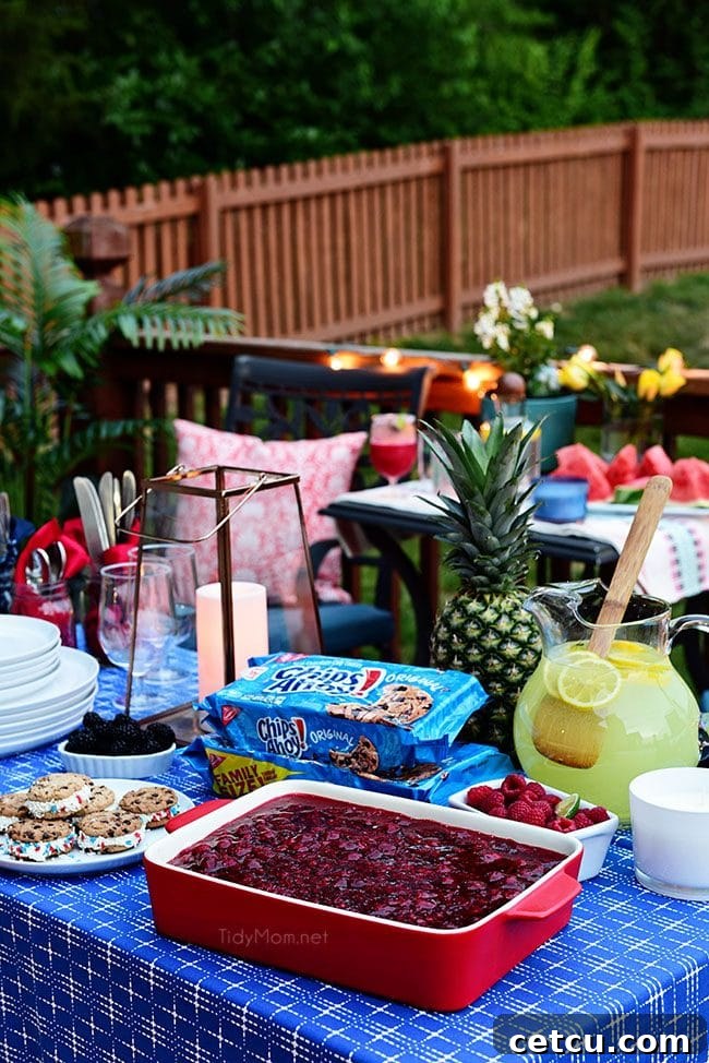 A beautifully set outdoor dining table under string lights, ready for a summer BBQ gathering.