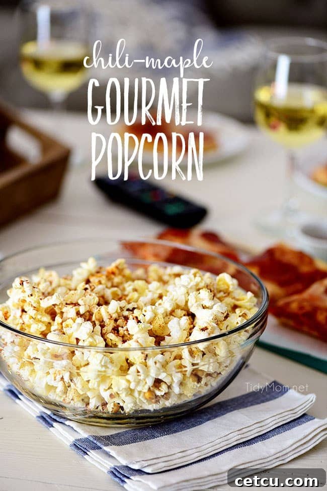 A bowl of Sweet Heat Maple-Chili Gourmet Popcorn ready for movie night, with a delicious DIGIORNO pizza blurred in the background. This image highlights the perfect pairing for a cozy evening, encouraging readers to try the homemade popcorn recipe from TidyMom.net.