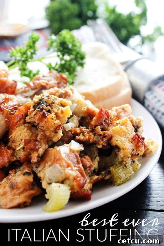 A baking dish filled with Best Ever Italian Stuffing from A Dash of Sanity, showing its golden-brown, crispy top and inviting texture.
