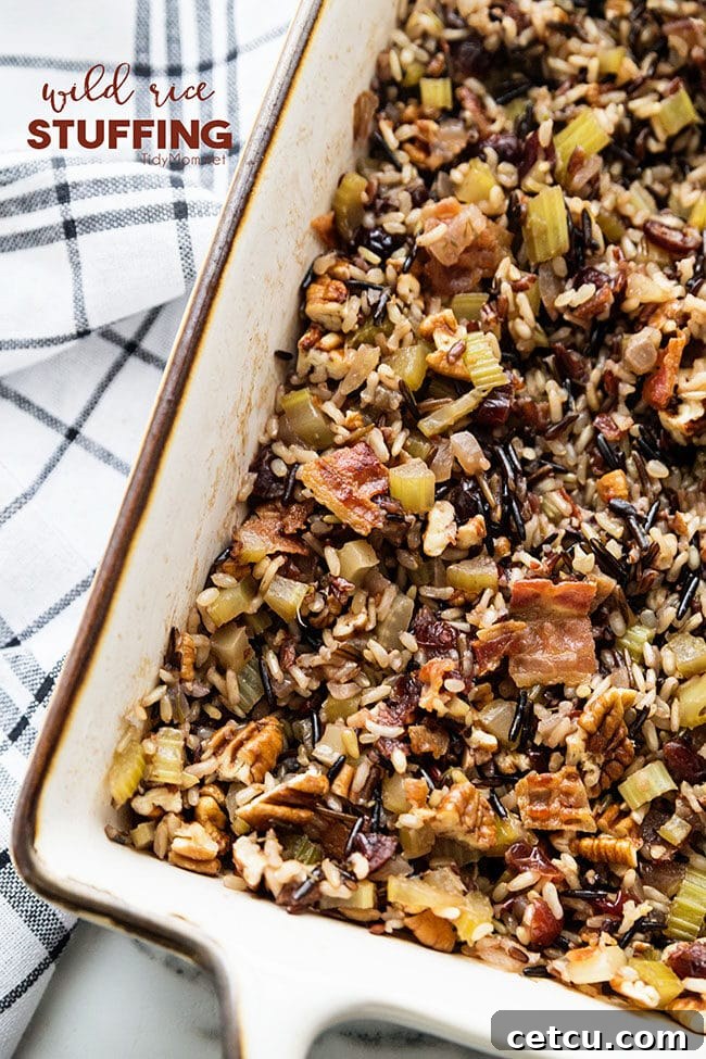 Wild rice stuffing presented in a baking dish, featuring its rich texture and colorful additions like dried cranberries, ready for serving.