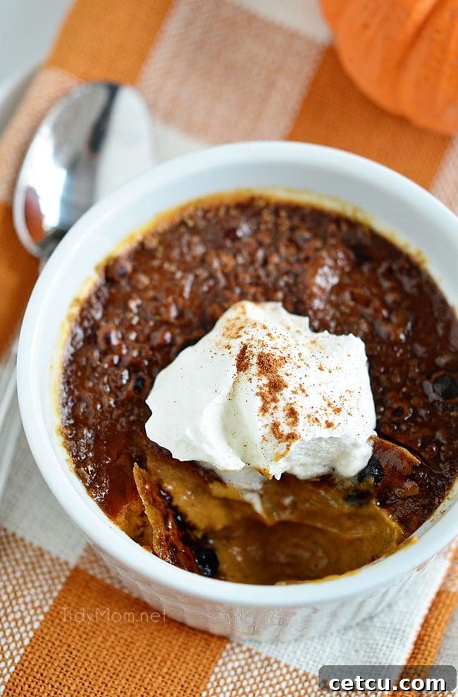 Pumpkin Creme Brulee in a ramekin, with a perfectly caramelized sugar crust, ready to be cracked.