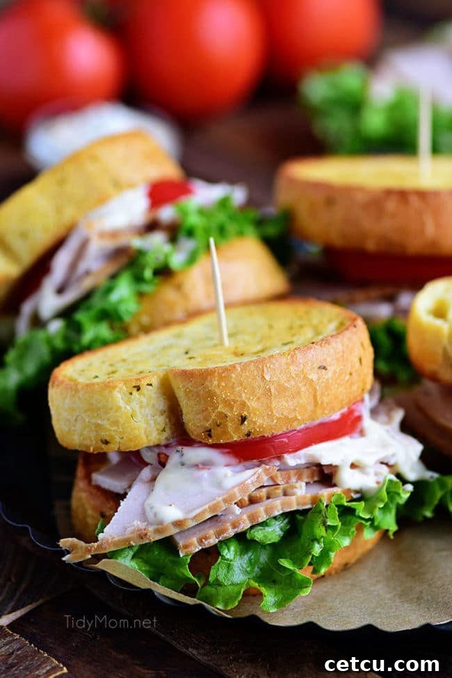 A delicious Turkey Caesar Sandwich on crispy garlic toast, filled with turkey, Caesar dressing, and fresh greens, perfect for using Thanksgiving leftovers.