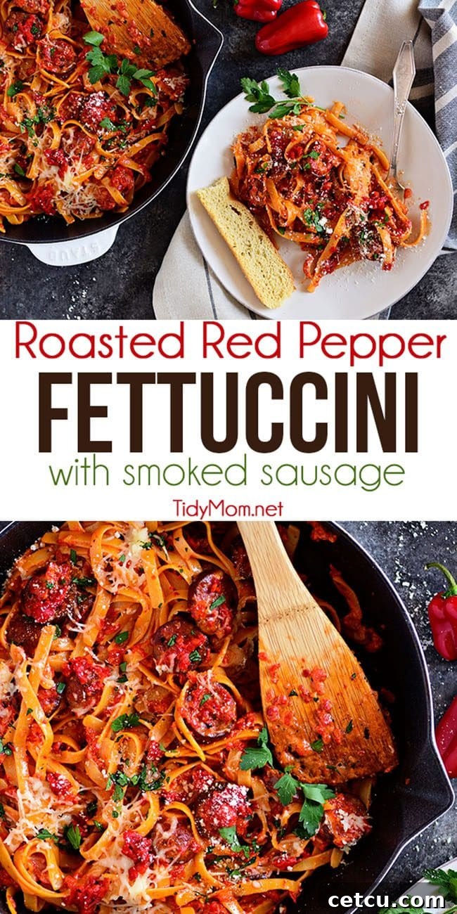 Amazing Delicious Roasted Red Pepper Fettuccine with Smoked Sausage in a white Staub skillet, ready for serving.