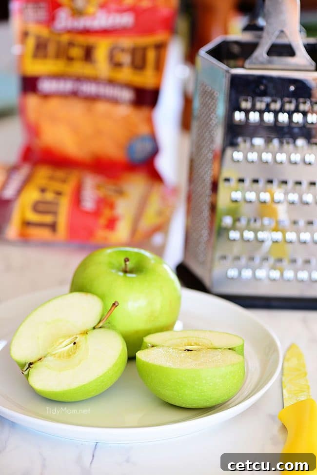 Granny Smith apples, a crisp and tart surprise ingredient, finely grated and added to the Apple Cheddar Pork Burgers for an unparalleled flavor.