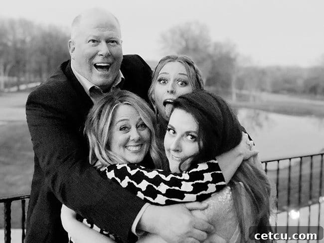 A cherished family portrait from 2018, capturing the joy and connection of the TidyMom family at a wedding event. Celebrating family memories.