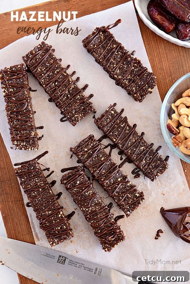 Homemade Hazelnut Energy Bars: Easy, No-Bake, Protein-Rich Snack with Hazelnuts, Pecans, Cashews & Chocolate HOMEMADE HAZELNUT ENERGY BARS on cutting board