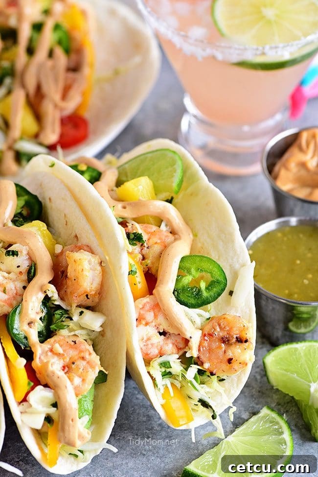 Close-up of Baja Shrimp Tacos with pineapple lime slaw and fresh toppings