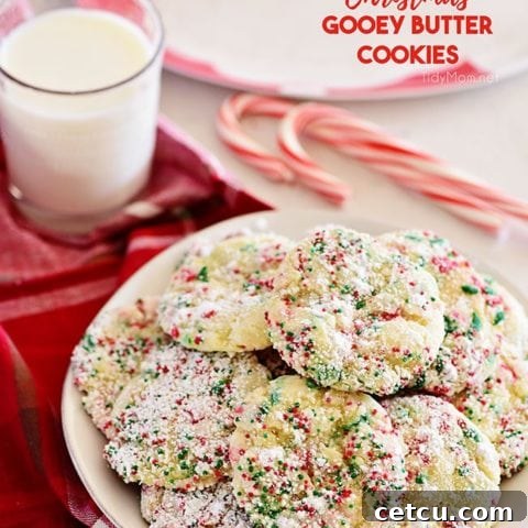 Christmas Gooey Butter Cookies on a plate with a glass of milk