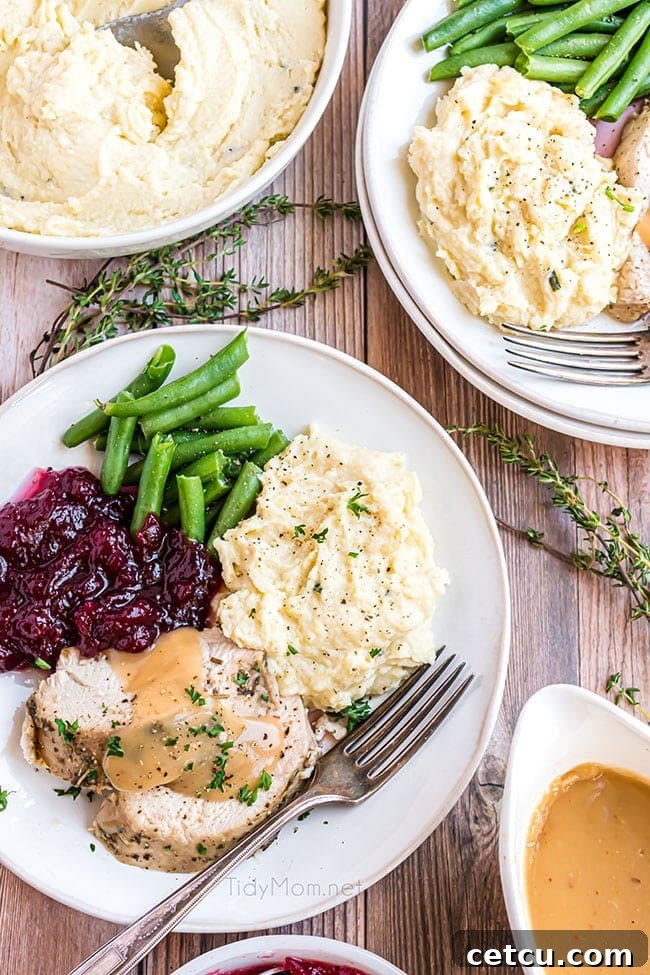 Prep-Ahead Perfection Mashed Potatoes 7 plate with holiday food including make ahead mashed potatoes, turkey, and green beans
