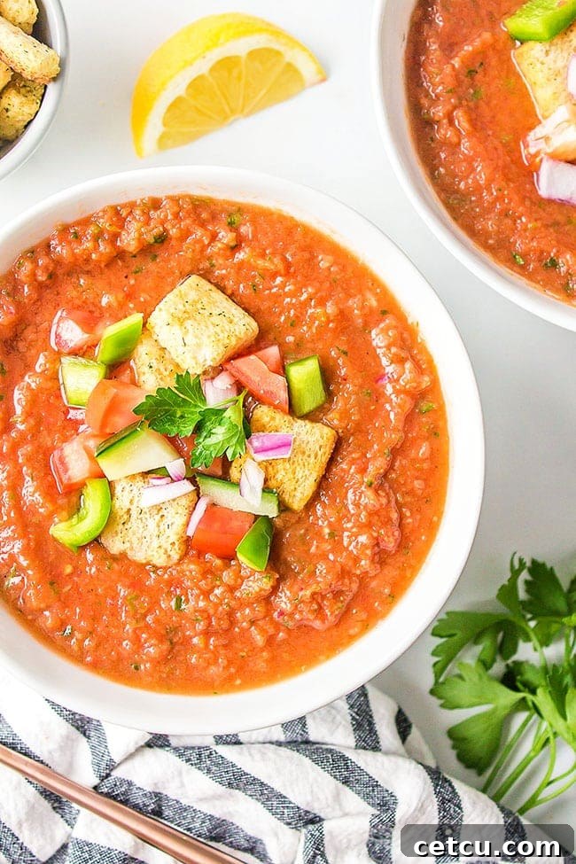 cold Spanish soup in a white bowl