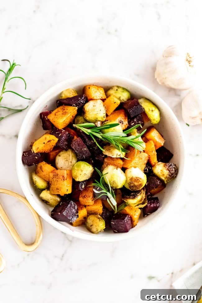 A rustic bowl filled with a generous portion of roasted root vegetables, showcasing their rich colors and inviting textures.