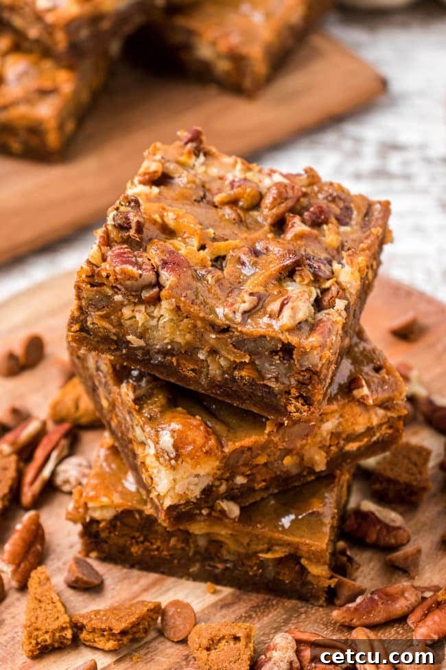 Autumn's Magical Seven Layer Pumpkin Bars 9 stack of pumpkin dessert bars, beautifully layered and ready to be enjoyed