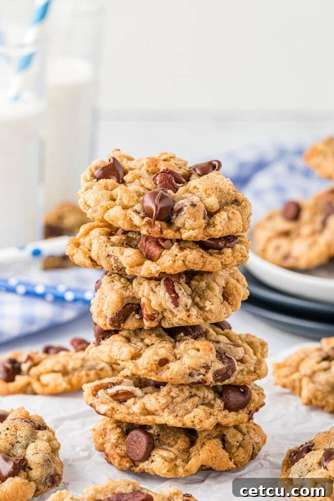 a stack of six golden-brown Ranger Cookies, highlighting their rich texture and delicious appearance.