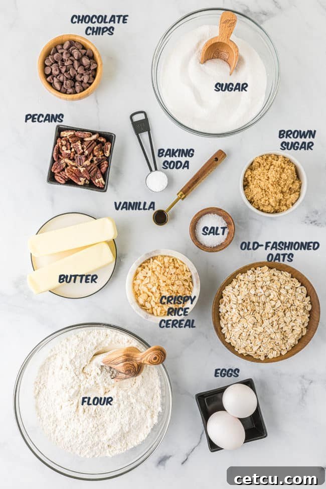 a flat lay image showcasing the various ingredients needed for making Ranger Cookies, including oats, chocolate chips, rice cereal, flour, sugar, and butter.