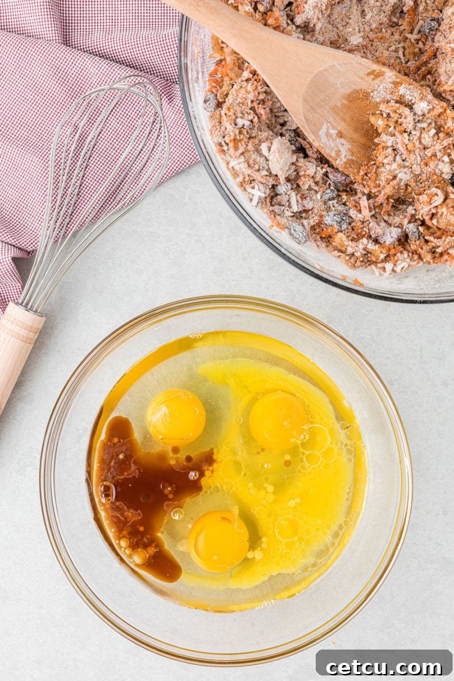 2 mixing bowls with muffin batter and a red and white towel